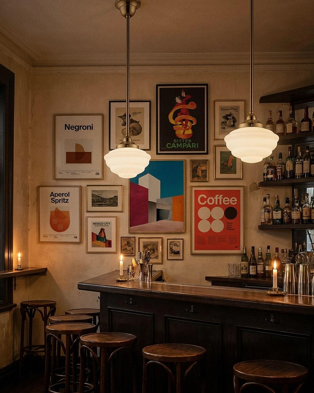 Cannes opal glass pendants on solid brass rod sets over a bar, the globe hidden behind the opal glass