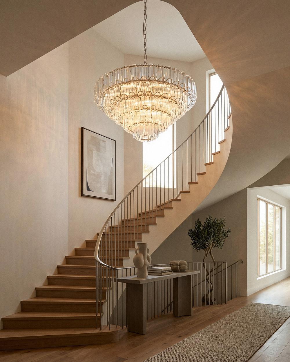 Calista extra large brushed nickel crystal chandelier in a curved staircase foyer