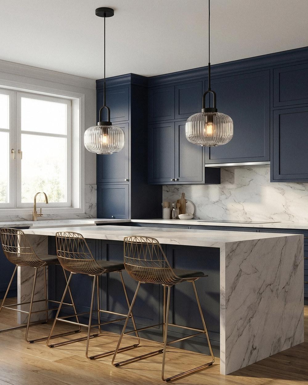 Main contemporary pendants in ribbed glass on black cord over a kitchen island